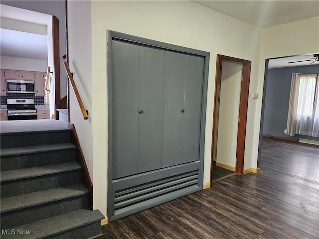 164 W High St, New Concord, OH 43762 - stairs featuring wood finished floors, baseboards, and ceiling fan