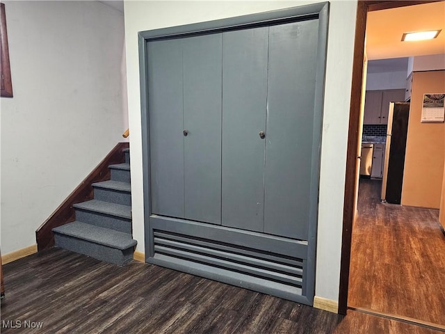 164 W High St, New Concord, OH 43762 - staircase featuring wood finished floors and baseboards