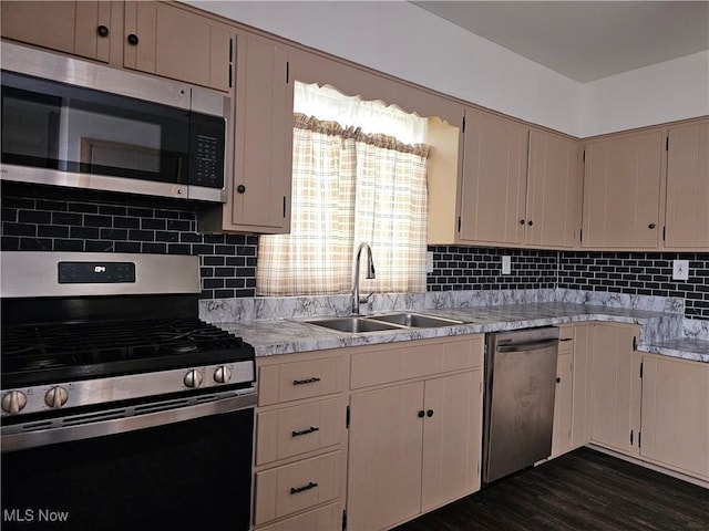 164 W High St, New Concord, OH 43762 - kitchen with stainless steel appliances, a sink, light countertops, and tasteful backsplash