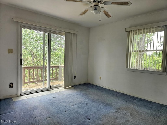 164 W High St, New Concord, OH 43762 - spare room featuring ceiling fan, carpet floors, and baseboards