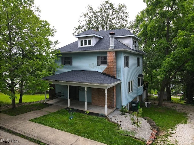 164 W High St, New Concord, OH 43762 - view of front of property featuring a front yard, covered porch, and roof with shingles