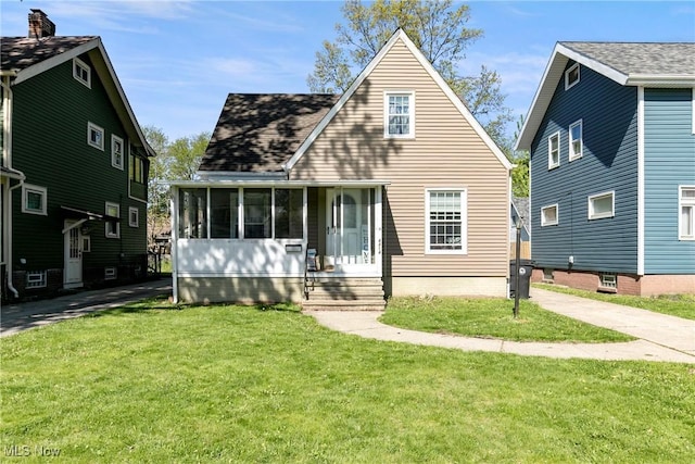 4414 W 171st St, Cleveland, OH 44135 - rear view of property with a lawn and a sunroom