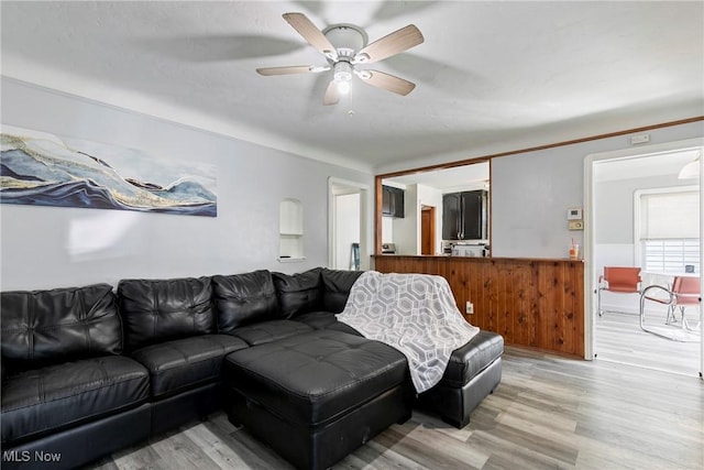 4414 W 171st St, Cleveland, OH 44135 - living area with light wood finished floors, ceiling fan, and wainscoting