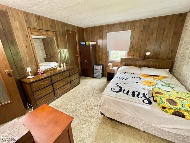 38722 State Route 518th Rd, Lisbon, OH 44432 - bedroom with light carpet and wood walls