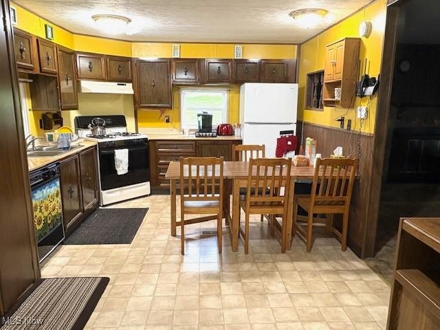 38722 State Route 518th Rd, Lisbon, OH 44432 - kitchen featuring white appliances, light countertops, range hood, dark brown cabinets, and wainscoting