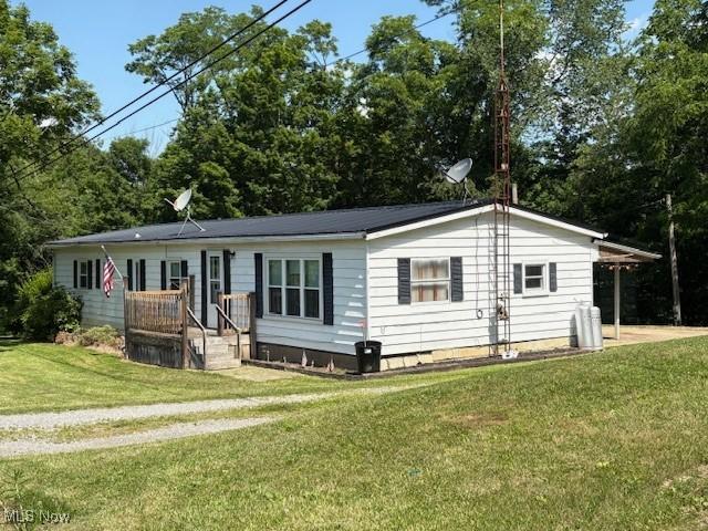38722 State Route 518th Rd, Lisbon, OH 44432 - view of front facade featuring a front lawn and crawl space