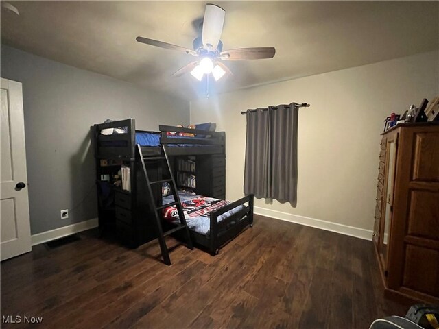 9355 Dozer Ridge Rd, Blue Rock, OH 43720 - bedroom featuring dark wood-type flooring, baseboards, and a ceiling fan