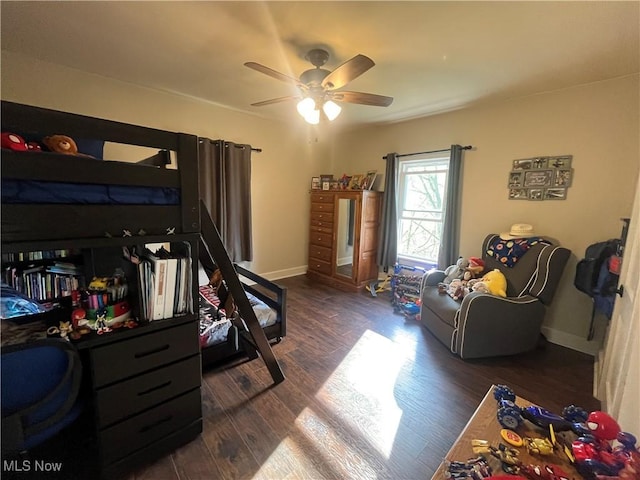9355 Dozer Ridge Rd, Blue Rock, OH 43720 - bedroom featuring dark wood-style floors, ceiling fan, and baseboards