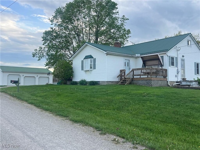 9355 Dozer Ridge Rd, Blue Rock, OH 43720 - view of front facade with a chimney, a front yard, metal roof, and a garage