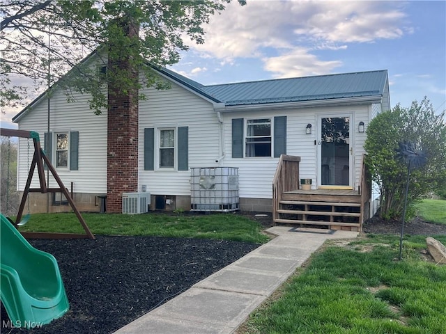 9355 Dozer Ridge Rd, Blue Rock, OH 43720 - back of house featuring a playground, metal roof, and cooling unit