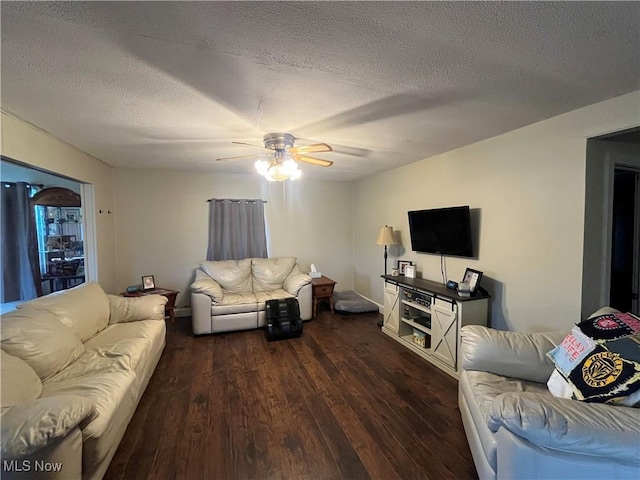 9355 Dozer Ridge Rd, Blue Rock, OH 43720 - living area featuring wood finished floors, ceiling fan, and a textured ceiling