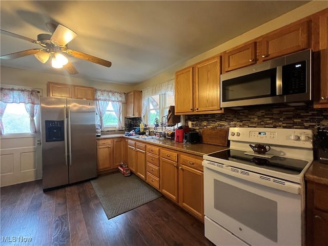 9355 Dozer Ridge Rd, Blue Rock, OH 43720 - kitchen featuring appliances with stainless steel finishes, dark wood-style floors, ceiling fan, and tasteful backsplash