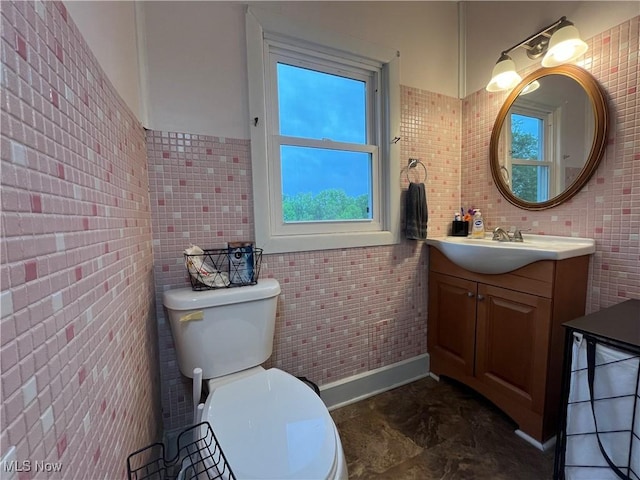 9355 Dozer Ridge Rd, Blue Rock, OH 43720 - bathroom with healthy amount of natural light, tile walls, toilet, and vanity