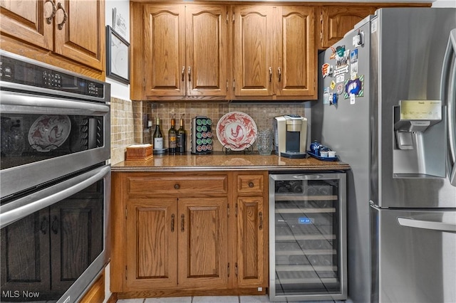 359 Boyce Dr, Chester, WV 26034 - kitchen with beverage cooler, stainless steel appliances, brown cabinetry, and backsplash