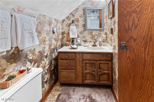 359 Boyce Dr, Chester, WV 26034 - bathroom featuring wallpapered walls, vanity, lofted ceiling, toilet, and baseboards