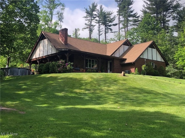 359 Boyce Dr, Chester, WV 26034 - view of front of home featuring a chimney, a front lawn, brick siding, and board and batten siding