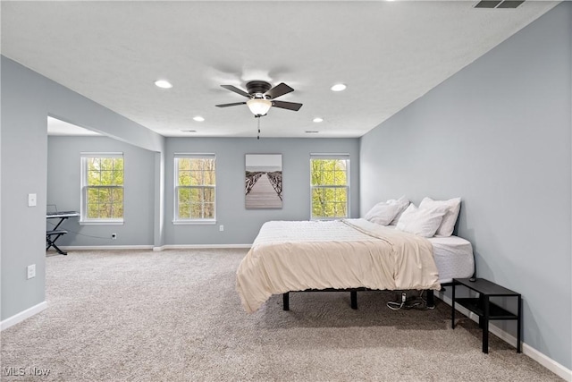 carpeted bedroom featuring baseboards, recessed lighting, and ceiling fan