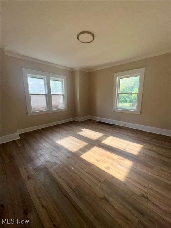 510 Parkcliffe Ave, Youngstown, OH 44511 - empty room featuring ornamental molding, dark wood-type flooring, and baseboards