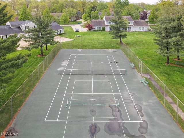 view of community featuring a tennis court