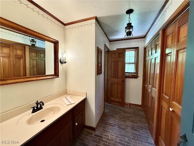 6859 Fairground Blvd, Canfield, OH 44406 - bathroom featuring brick floors, baseboards, crown molding, and vanity