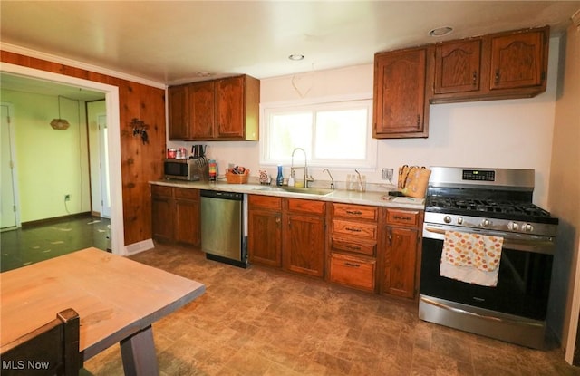 36751 Sugar Ridge Rd, North Ridgeville, OH 44039 - kitchen with appliances with stainless steel finishes, a sink, light countertops, brown cabinetry, and recessed lighting