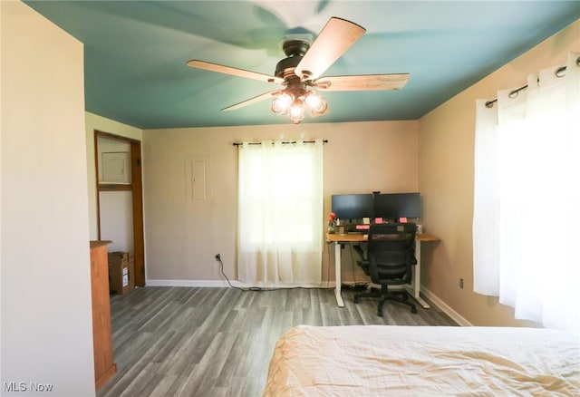 36751 Sugar Ridge Rd, North Ridgeville, OH 44039 - bedroom featuring wood finished floors, baseboards, a ceiling fan, and a desk