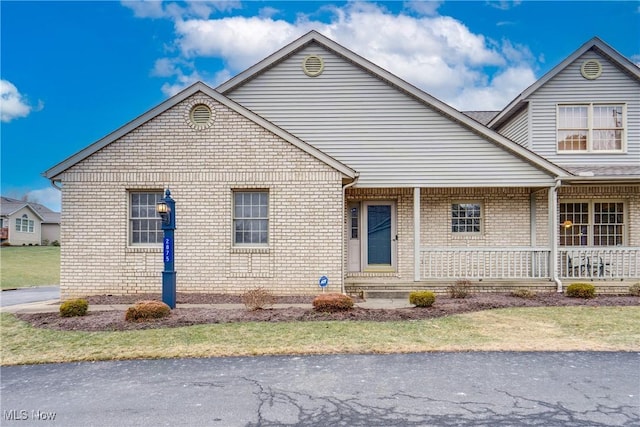 2875 Sherwood Ave NW, Massillon, OH 44646 - view of front of home with covered porch and brick siding