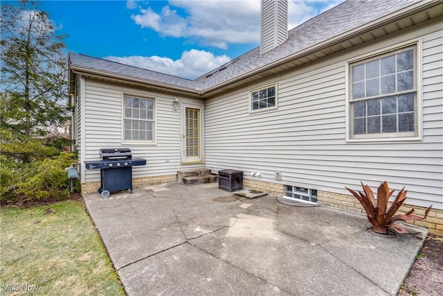 2875 Sherwood Ave NW, Massillon, OH 44646 - back of house with a patio area, a chimney, and a shingled roof