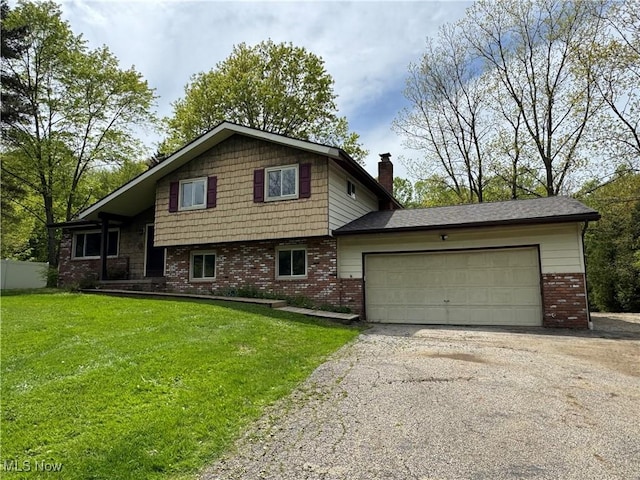 split level home with brick siding, a chimney, asphalt driveway, and an attached garage