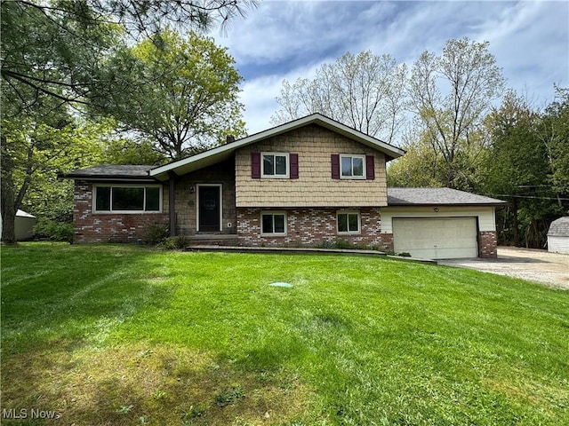 tri-level home with an attached garage, brick siding, driveway, and a front lawn