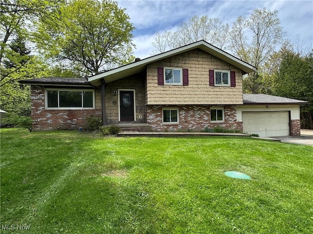 split level home featuring an attached garage, brick siding, driveway, and a front lawn