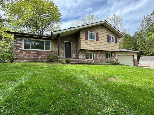 split level home featuring brick siding, an attached garage, a front yard, and concrete driveway