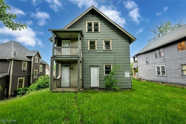 1324-1326 Shorb Ave NW, Canton, OH 44703 - rear view of property featuring a balcony and a lawn