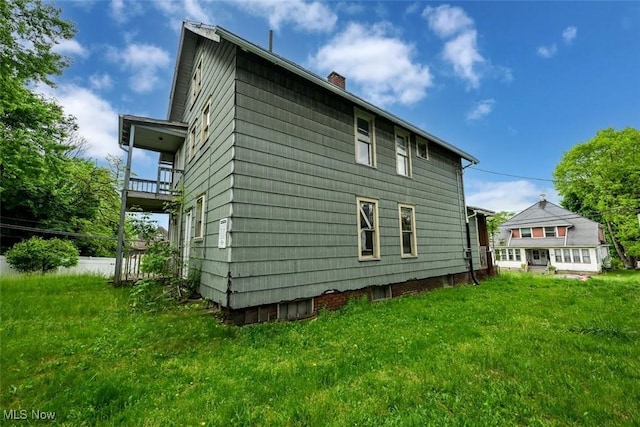 1324-1326 Shorb Ave NW, Canton, OH 44703 - back of property with a balcony, a chimney, and a yard