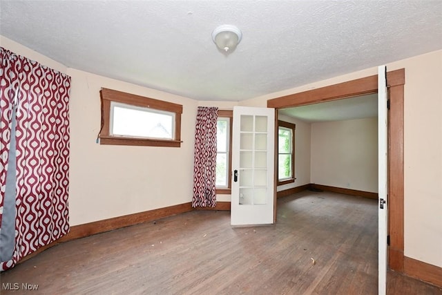 1324-1326 Shorb Ave NW, Canton, OH 44703 - spare room featuring wood finished floors and baseboards