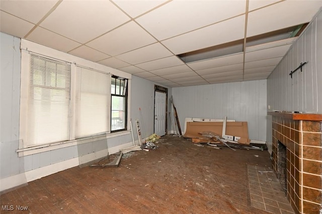 1324-1326 Shorb Ave NW, Canton, OH 44703 - empty room featuring a paneled ceiling, a fireplace, and baseboards