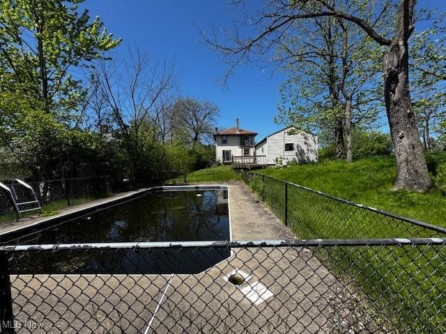 250 Center Rd, Bedford, OH 44146 - view of swimming pool featuring fence