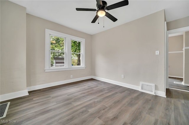 3692 E 118th St, Cleveland, OH 44105 - unfurnished room featuring wood finished floors, baseboards, and ceiling fan