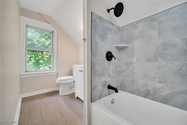 3692 E 118th St, Cleveland, OH 44105 - bathroom featuring baseboards, wood finished floors, vaulted ceiling, toilet, and shower / washtub combination