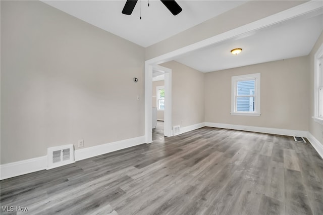3692 E 118th St, Cleveland, OH 44105 - spare room featuring ceiling fan, wood finished floors, and baseboards