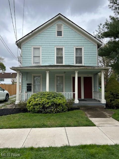 16 E S St, Painesville, OH 44077 - view of front of house featuring covered porch and fence