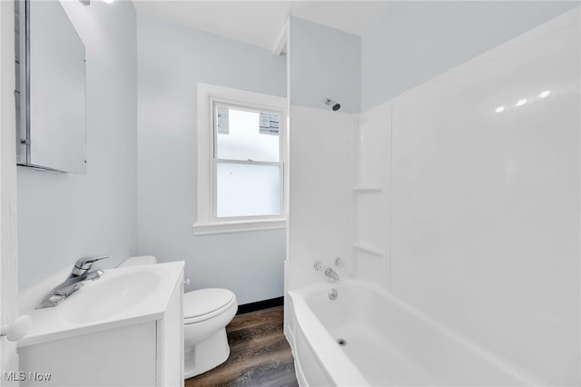 2040 W 103rd St, Cleveland, OH 44102 - full bathroom with wood finished floors, vanity, toilet, shower / tub combination, and baseboards