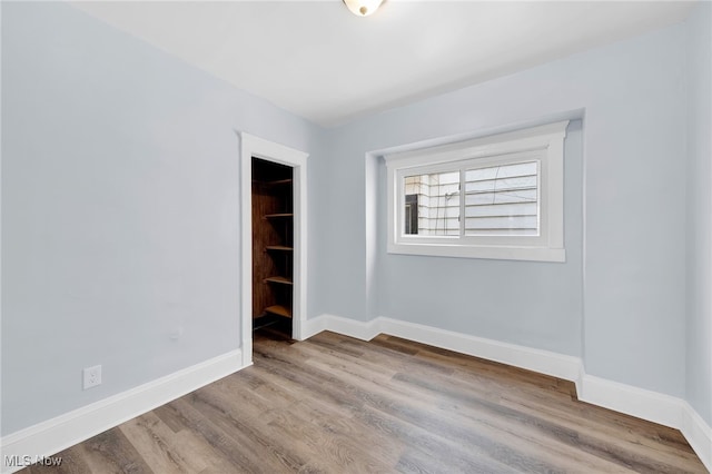 2040 W 103rd St, Cleveland, OH 44102 - empty room featuring baseboards and wood finished floors