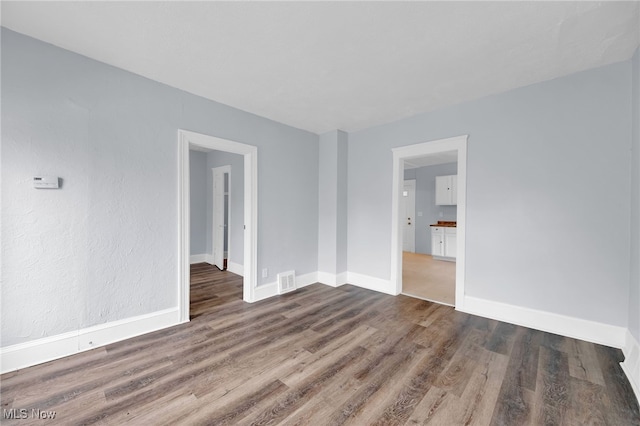 2040 W 103rd St, Cleveland, OH 44102 - empty room featuring wood finished floors and baseboards