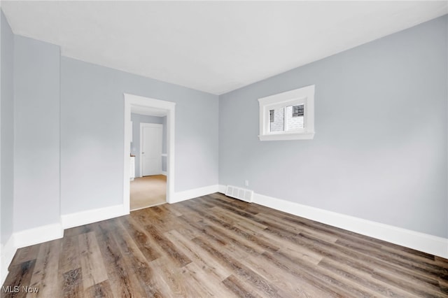 2040 W 103rd St, Cleveland, OH 44102 - unfurnished room featuring wood finished floors and baseboards