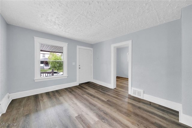 2040 W 103rd St, Cleveland, OH 44102 - empty room featuring wood finished floors and baseboards