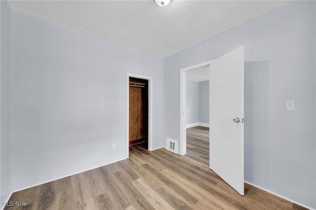 2040 W 103rd St, Cleveland, OH 44102 - spare room with wood finished floors and baseboards