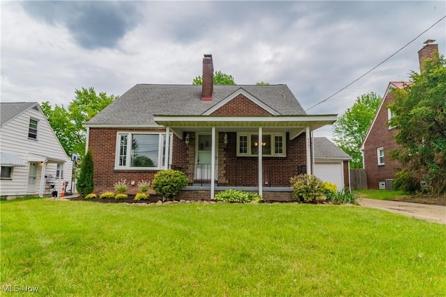 459 N Osborn Ave, Youngstown, OH 44509 - bungalow-style house featuring brick siding, a porch, a chimney, and a front lawn