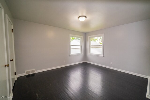 459 N Osborn Ave, Youngstown, OH 44509 - unfurnished room featuring baseboards and dark wood-type flooring