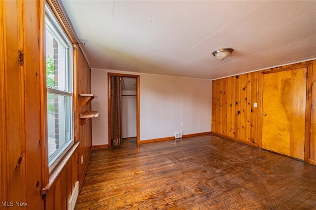 459 N Osborn Ave, Youngstown, OH 44509 - spare room featuring wood finished floors, healthy amount of natural light, baseboards, and wooden walls
